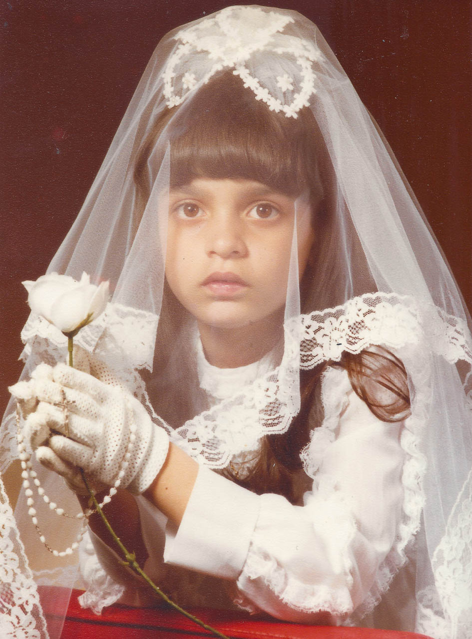 Catholic School Girl In White Dress For Her First Communion